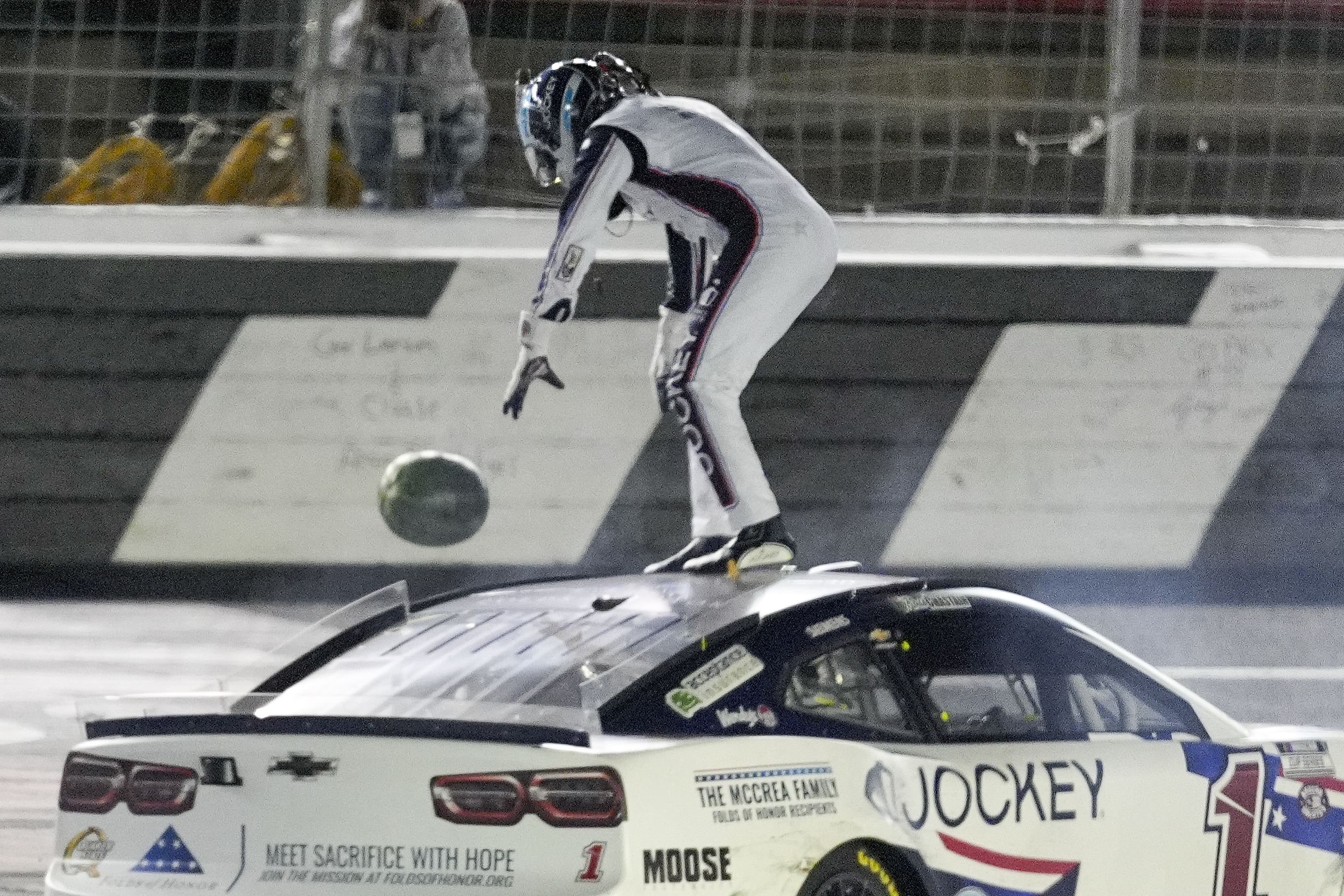 Ross Chastain (1) ceremoniously throws a watermelon after the Coca-Cola 600 at Charlotte. Source: Imagn